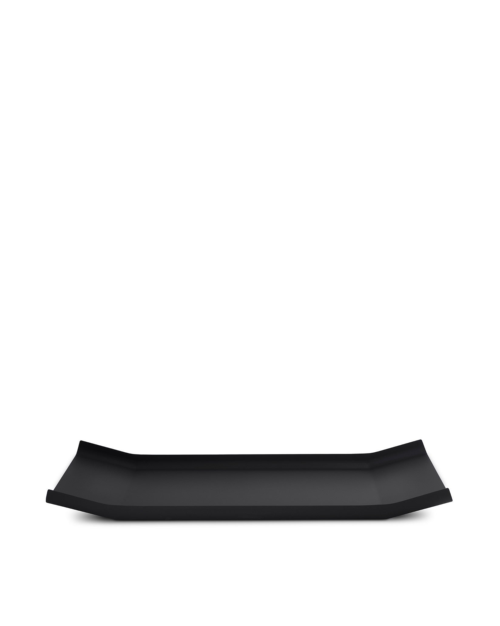 Black rectangular tray by Alessi with raised, curved short ends on a white background.