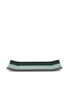 Iridescent metallic tray by Alessi, with a teal surface and purple-bronze edges, presented horizontally.