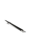 Black chopsticks with silver ends by Alessi, resting on a silver chopstick rest and featuring decorative head-shaped tips.