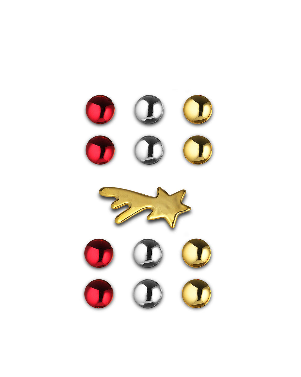 Christmas ornaments by Alessi featuring shiny red, silver, and gold spheres, and a gold shooting star.