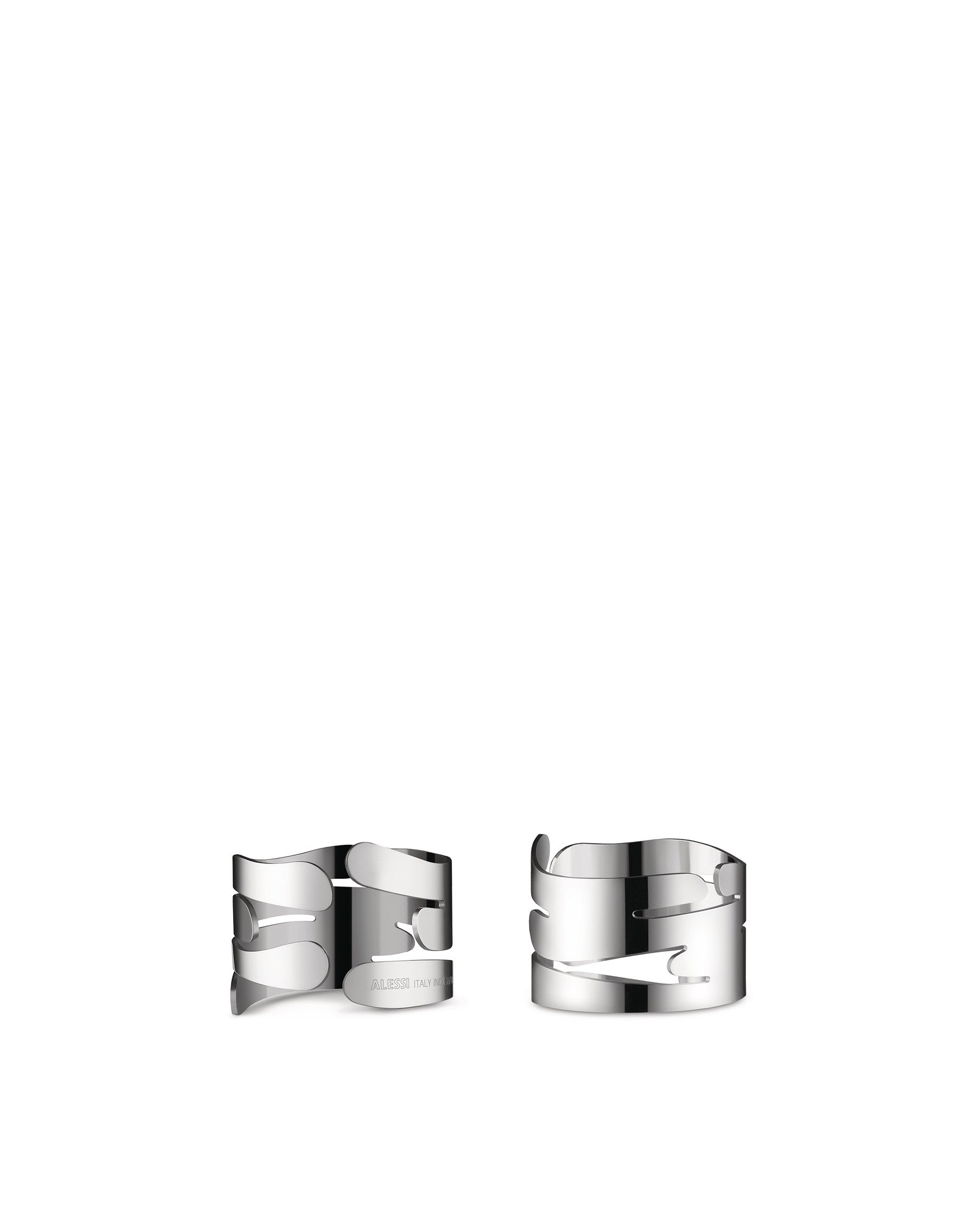 Two silver metal Barkring napkin holders by Alessi with organic tree bark-inspired cut-out designs.