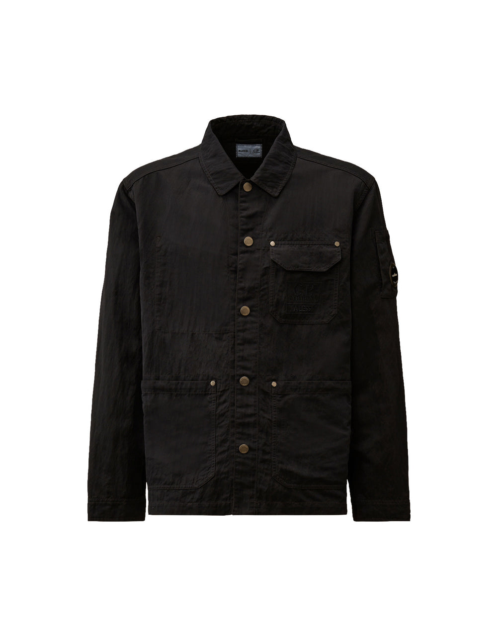 Black textured jacket by Alessi with collared neckline, button front, utility pockets including a chest pocket with 'C.P. Company ALESSI' text, and sleeve lens detail.