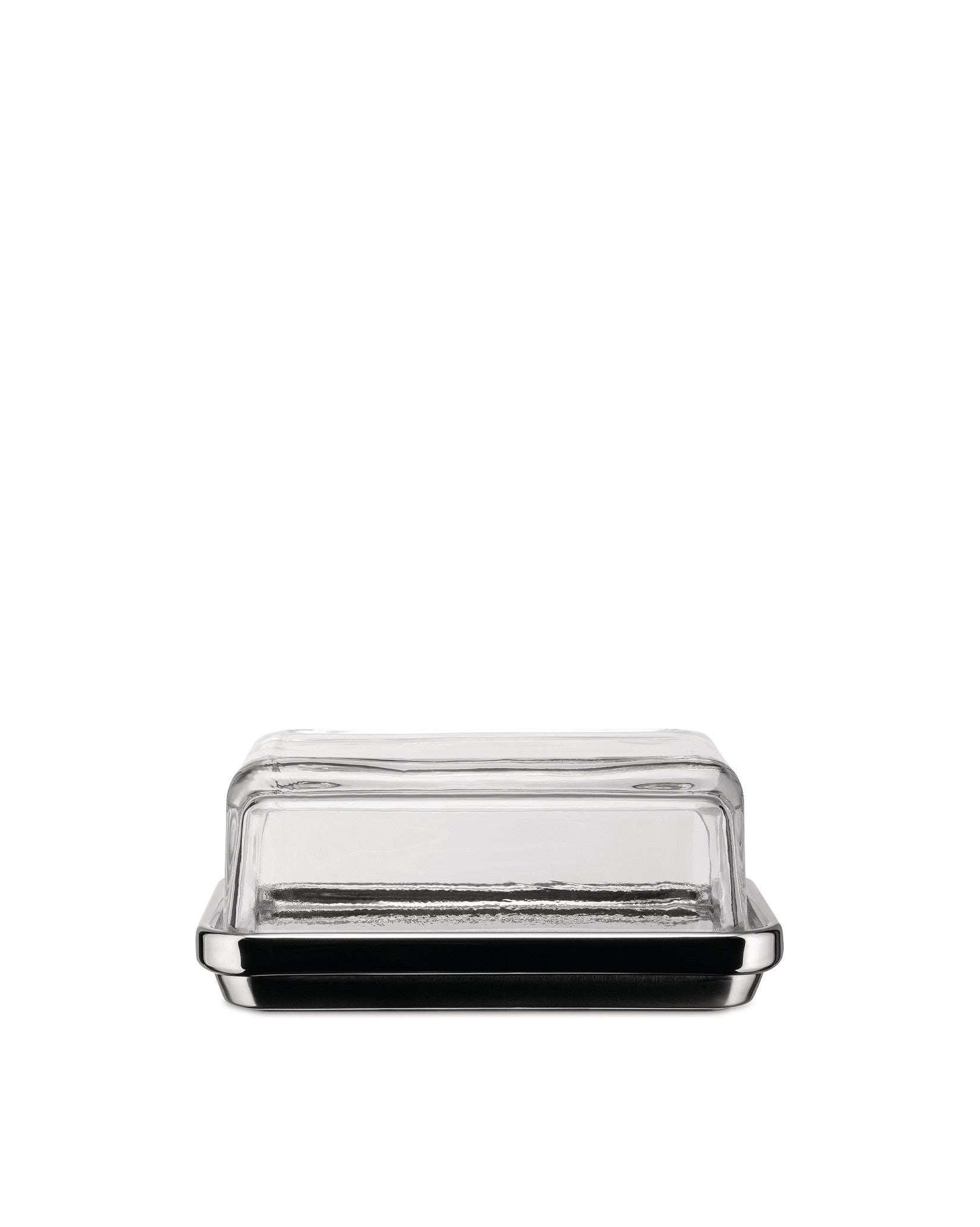 Clear glass butter dish by Alessi with a shiny silver-toned base, centered on a white background.