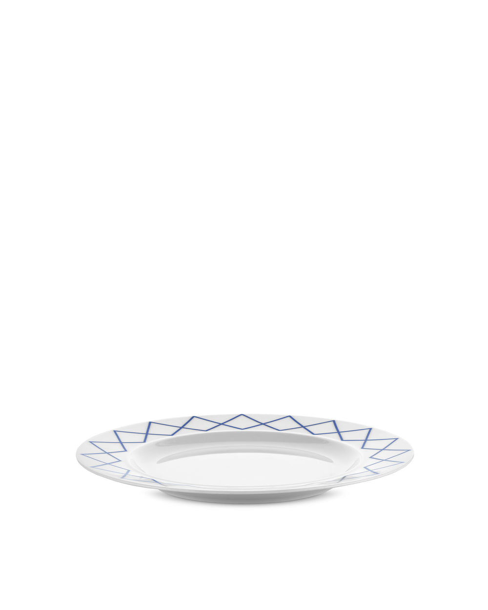 White dining plate by Alessi with a blue geometric zigzag pattern around the rim.