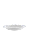 White serving plate by Alessi with a blue geometric patterned rim.