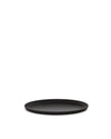 Black round tray by Alessi with a distinctive fluted edge, viewed at an angle.