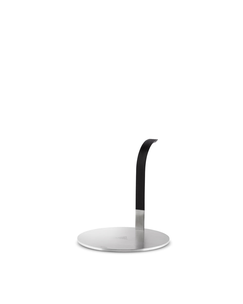 Stainless steel paper towel holder by Alessi with a round base and a matte black, curved upright arm.