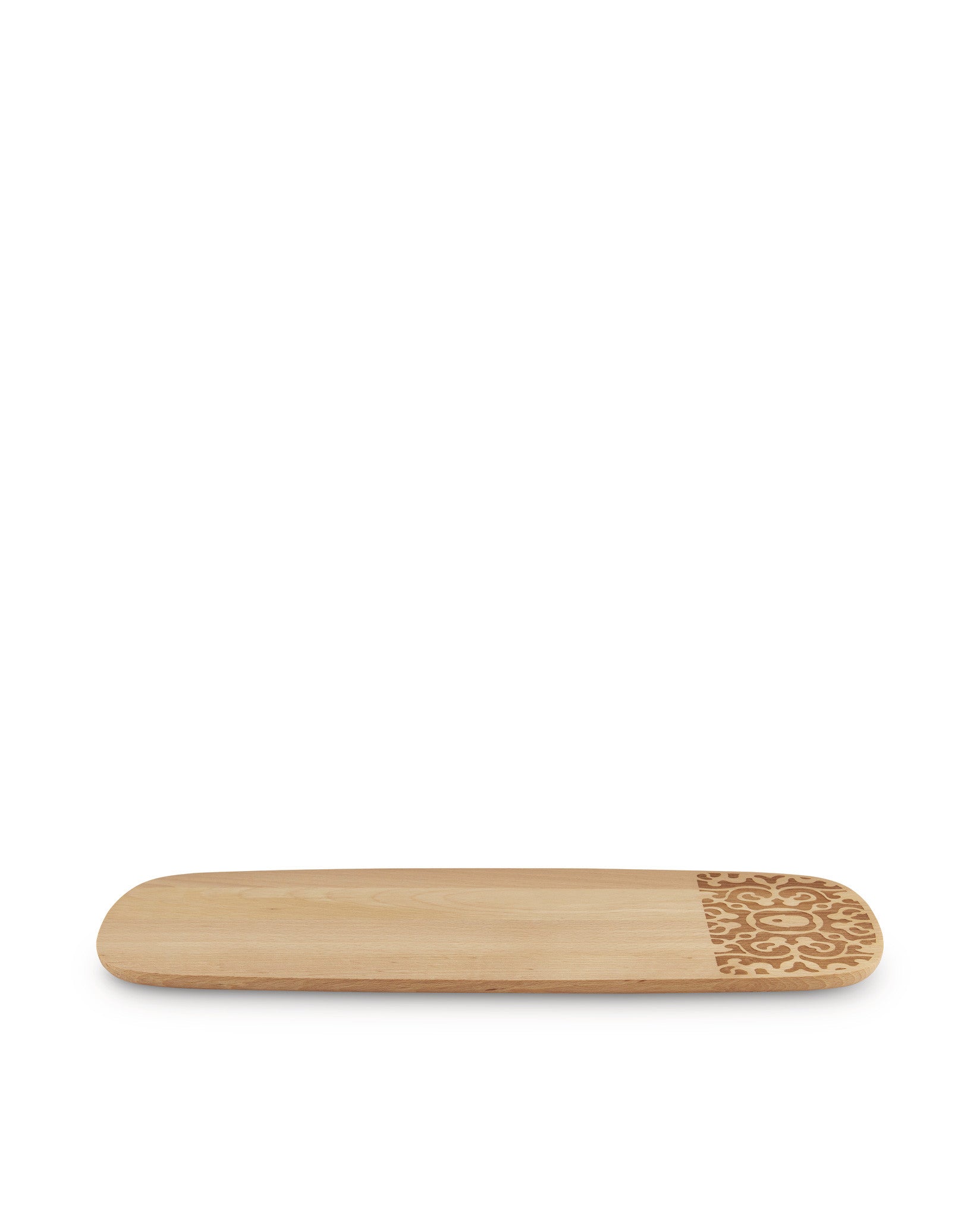 A light brown wooden serving plate by Alessi with an ornate geometric pattern etched on one end.