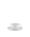 White ceramic teacup and saucer by Alessi, with a simple, clean design.