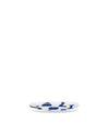 White oval serving platter by Alessi, decorated with abstract blue patterns, presented at an angle.