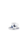 White ceramic espresso cup and saucer by Alessi, decorated with bold blue abstract shapes.