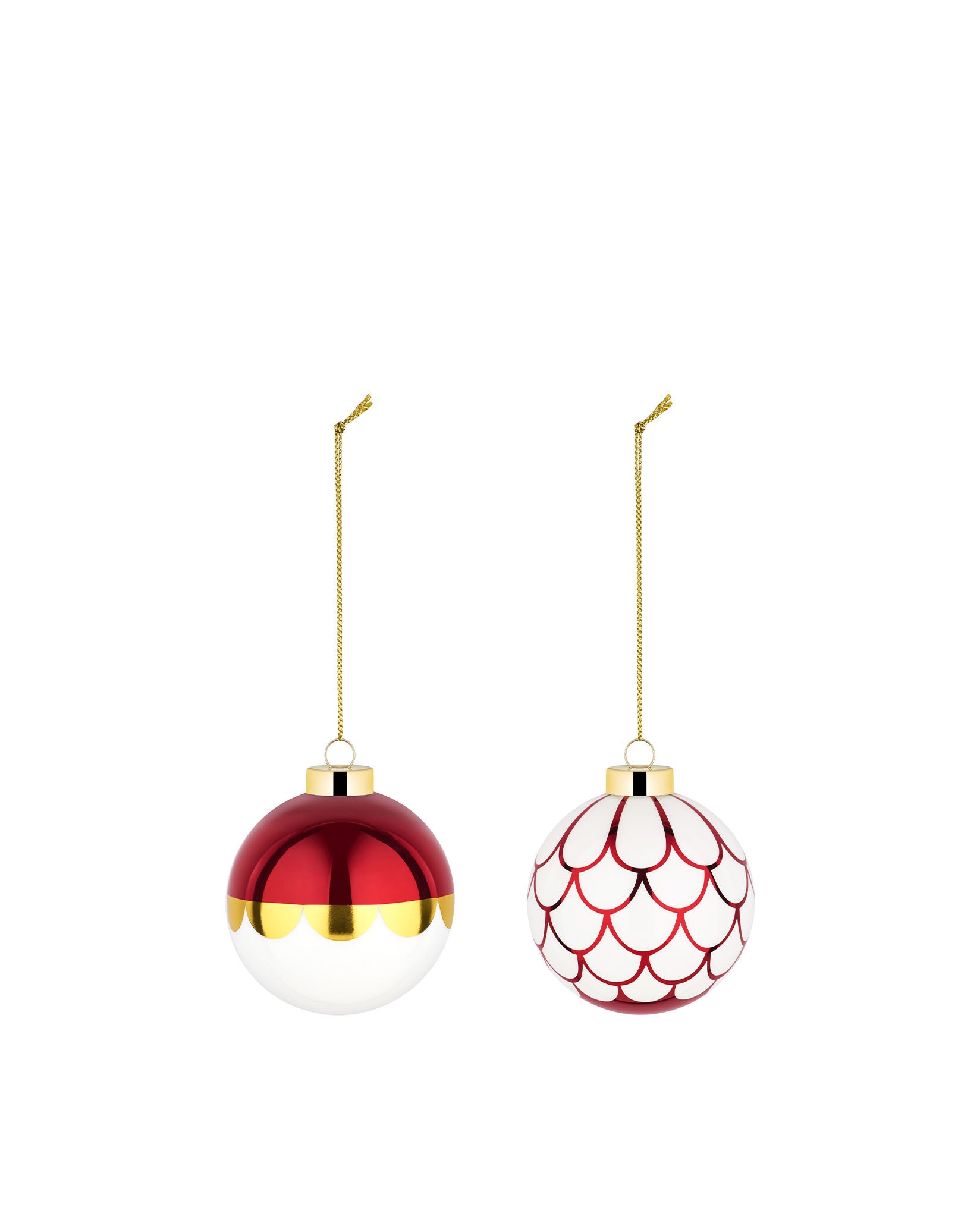 Two glossy red and white Christmas tree ornaments by Alessi, one with a gold scalloped band, the other with red scale patterns, hanging.