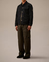 Dark navy jacket by Alessi with a subtle texture, light buttons, and a C.P. Company lens detail on the sleeve.