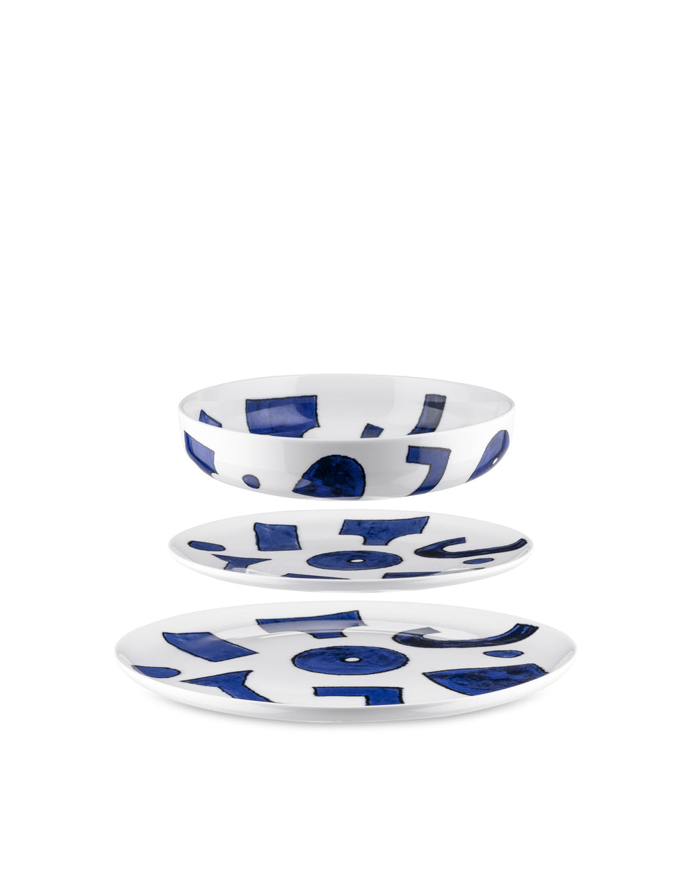 White porcelain table set by Alessi, featuring abstract blue shapes, stacked on a white background.