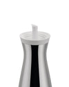 Silver oil cruet with a white lid and spout by Alessi, featuring a reflective, hourglass-shaped body, cropped view.