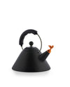 Black conical kettle by Alessi with a black handle, metal arc, orange bird-shaped whistle, and dotted base.