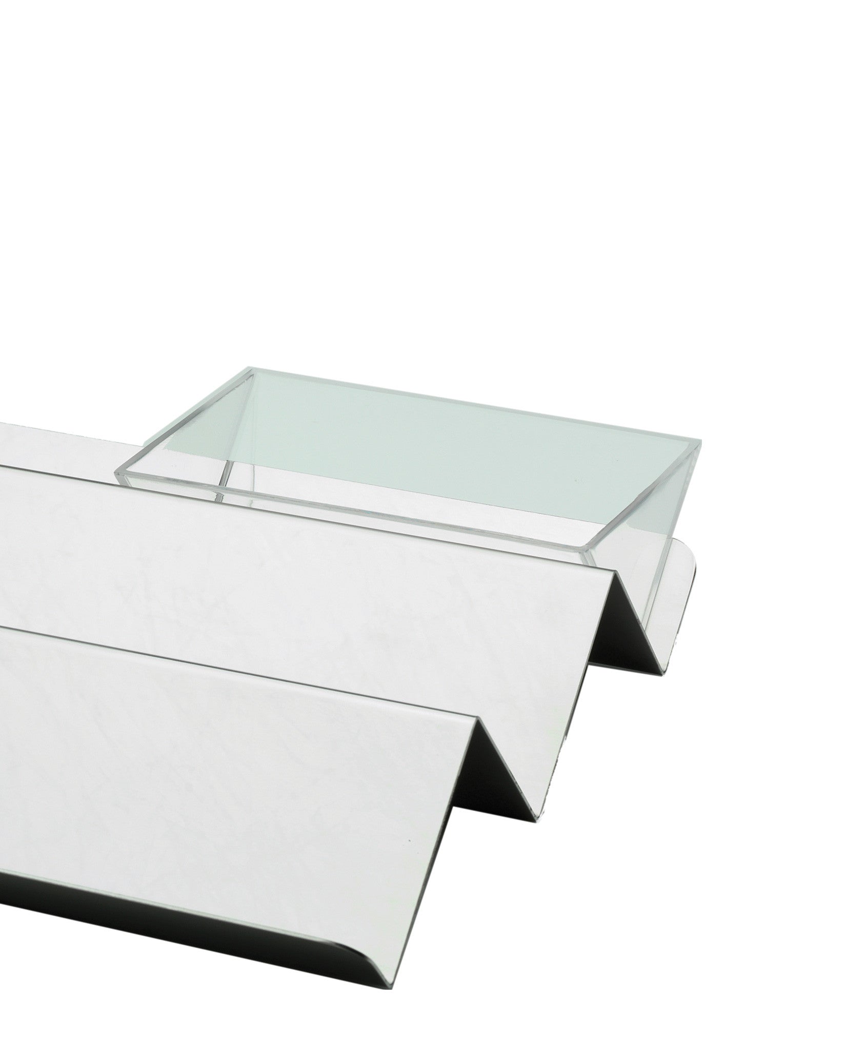 Reflective V tray by Alessi with a zigzag base and clear rectangular top.