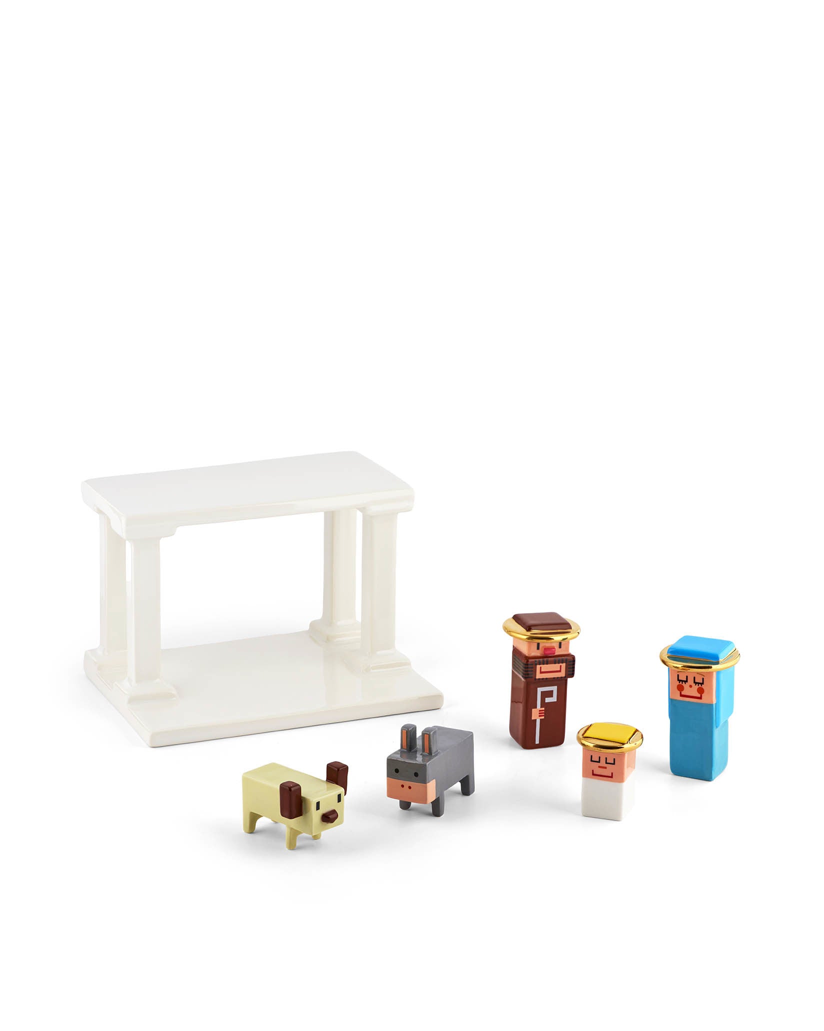 Colorful block-like Nativity scene by Alessi featuring a white stable and five stylized figures on white.