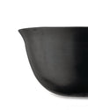 A dark grey bowl with subtle horizontal ridges by Alessi, shown in a cropped side view.