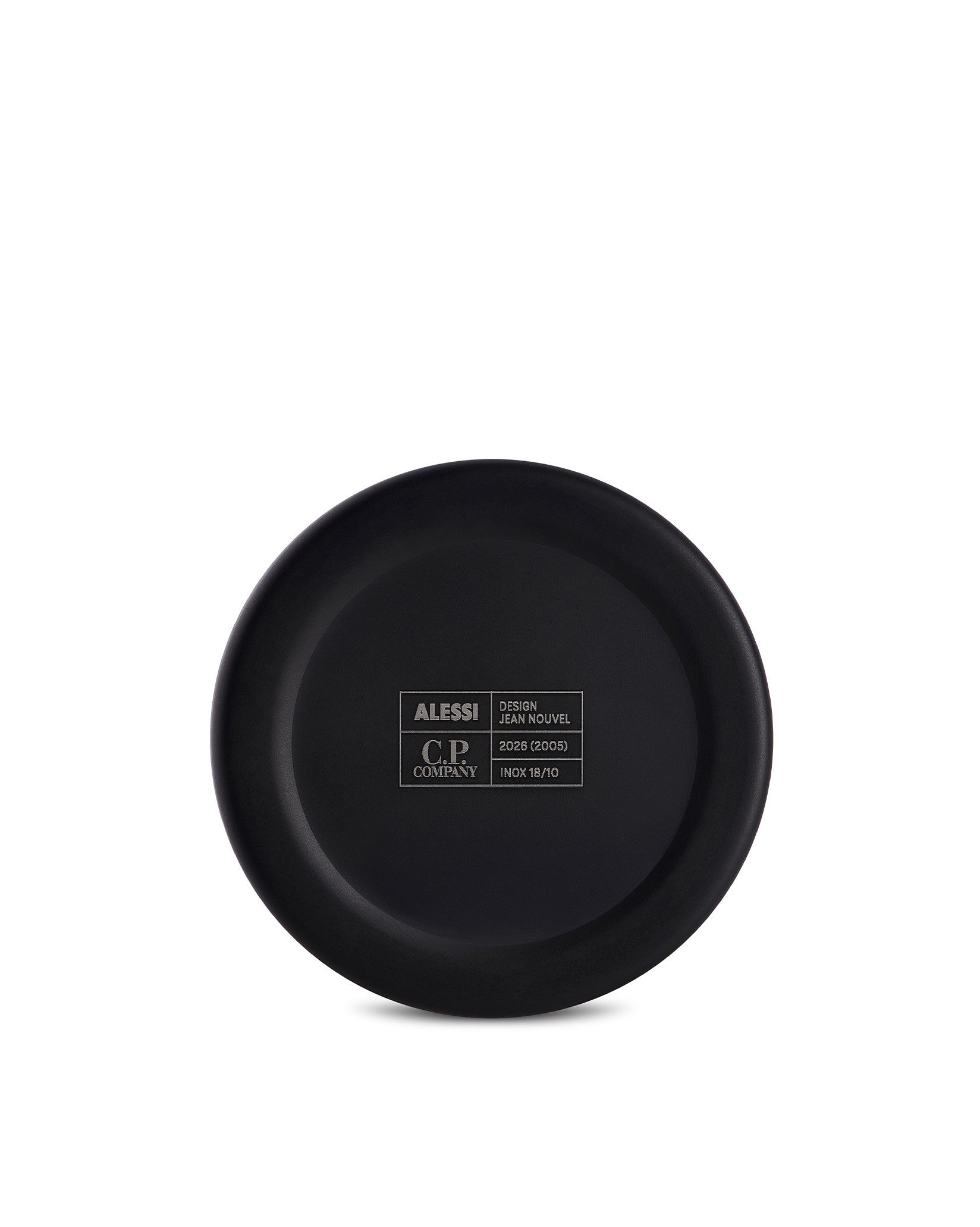 Black stainless steel cup by Alessi, showing the matte bottom with engraved design and brand details.