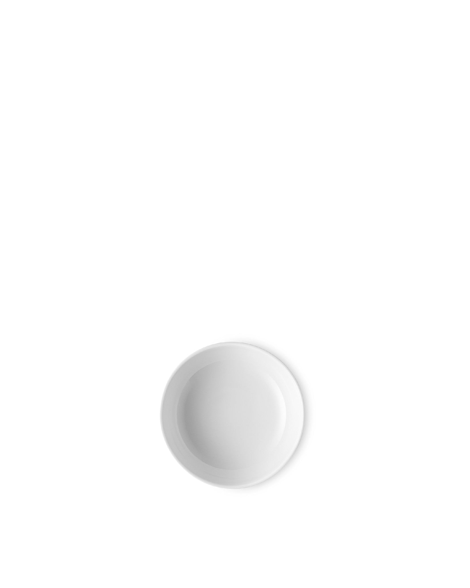 White small bowl by Alessi, round with a simple design, viewed from overhead.