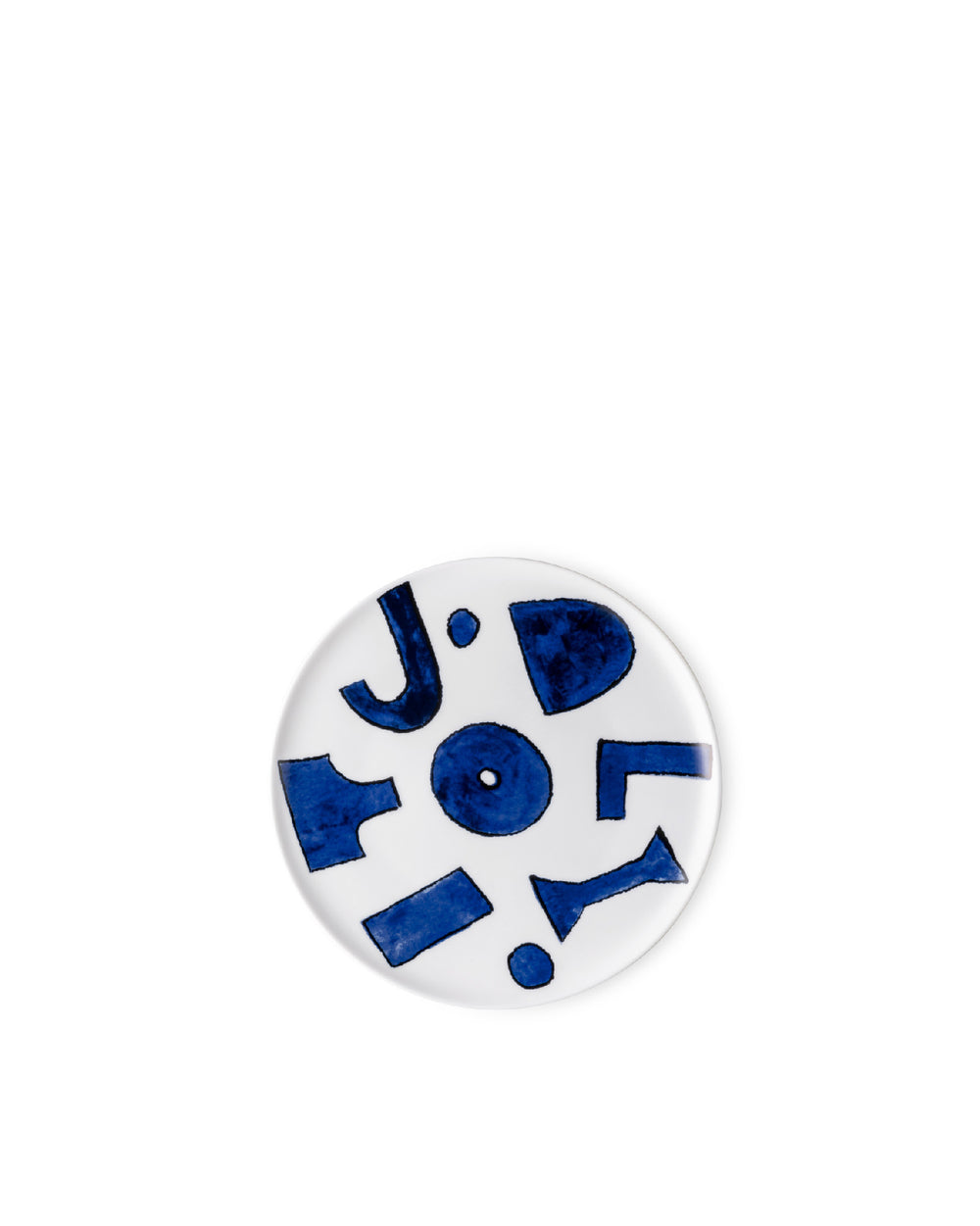 A white Yunoki ware plate by Alessi, decorated with abstract blue shapes and letters.