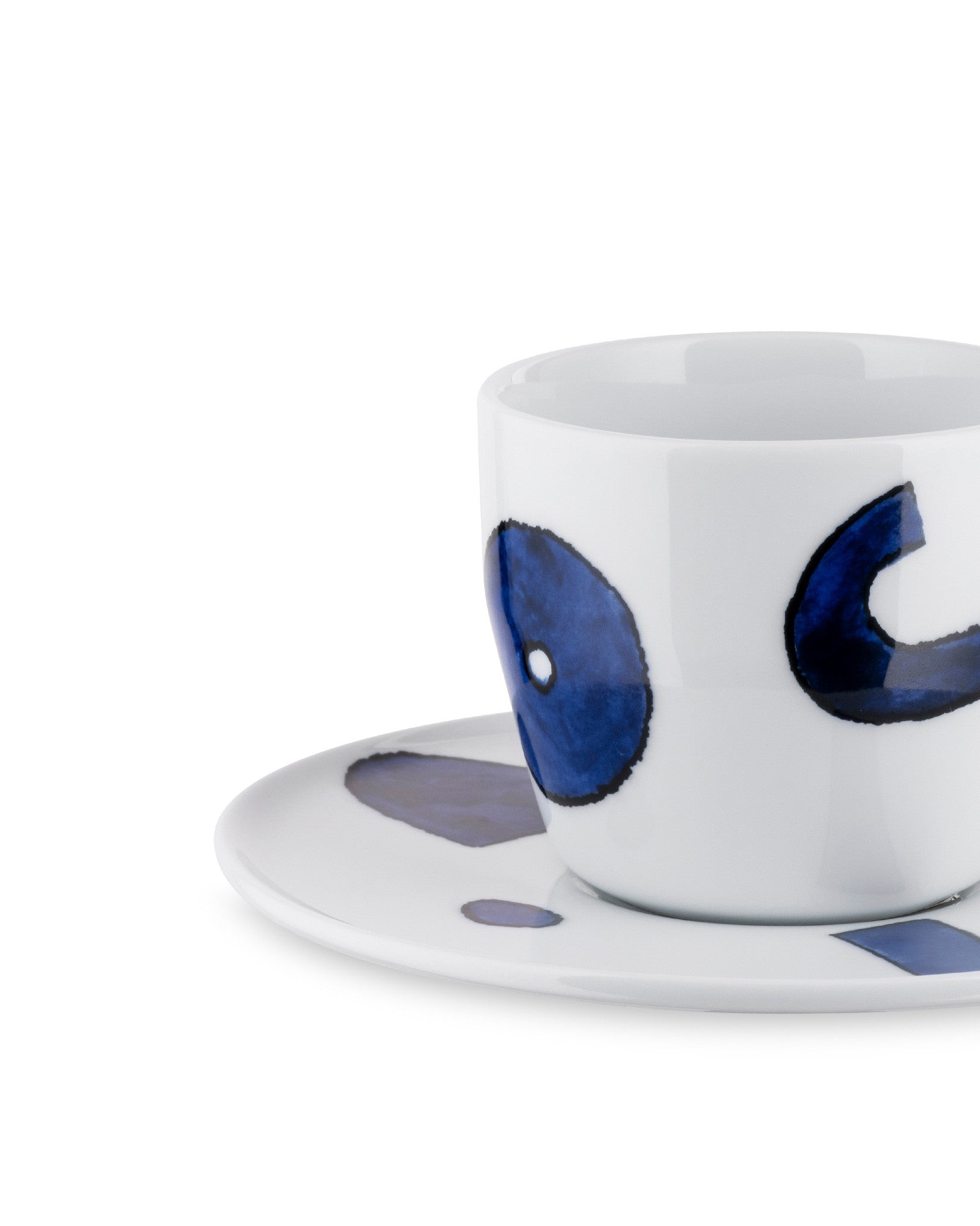 Yunoki ware cup and saucer by Alessi, white with abstract blue patterns, shown at a slight angle.