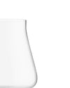 Elegant clear red wine glass by Alessi, with a curved shape, cropped.