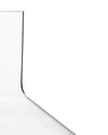 Clear glass decanter by Alessi with a smooth, curving silhouette on a white background.