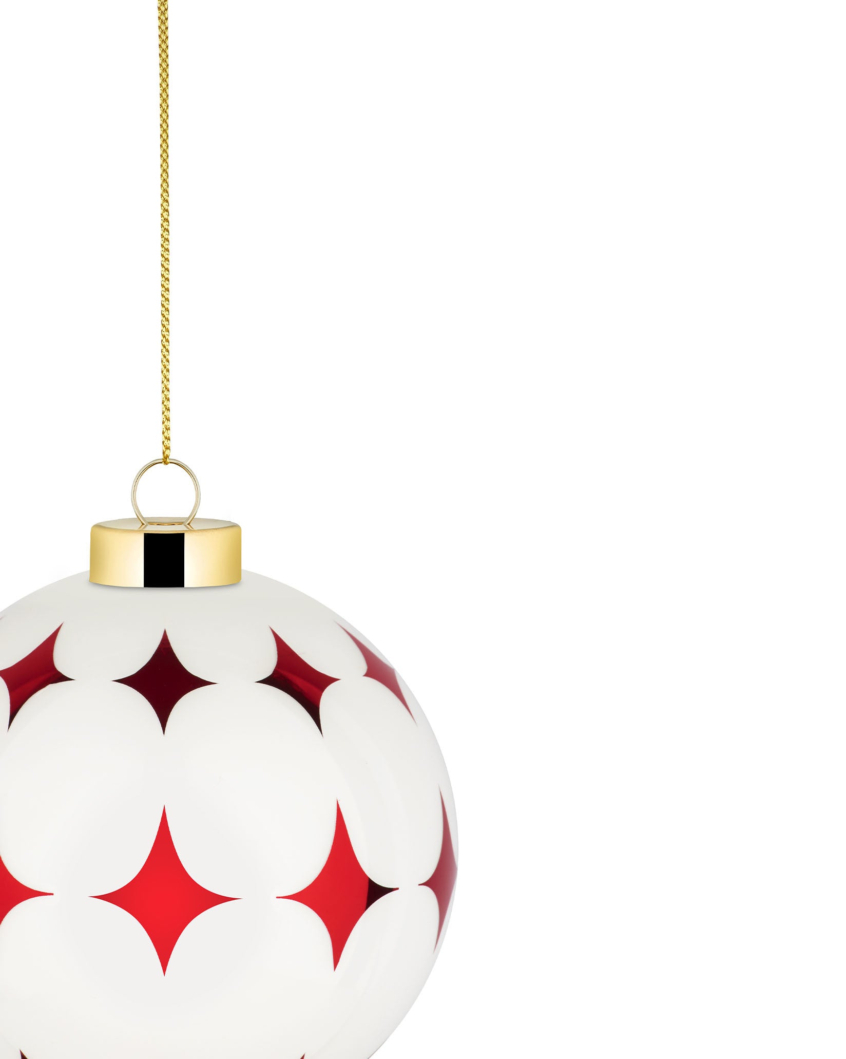 White Christmas tree ornament by Alessi with red star-like pattern, gold cap, and chain.