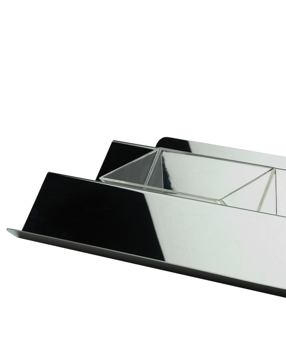 Black and silver V-tray by Alessi with a high-shine reflective finish and clear geometric design.