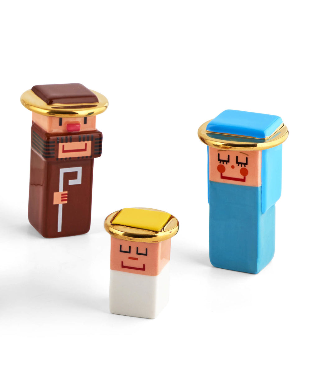 Colorful blocky nativity figures by Alessi, featuring minimalist pixelated faces and gold halos.