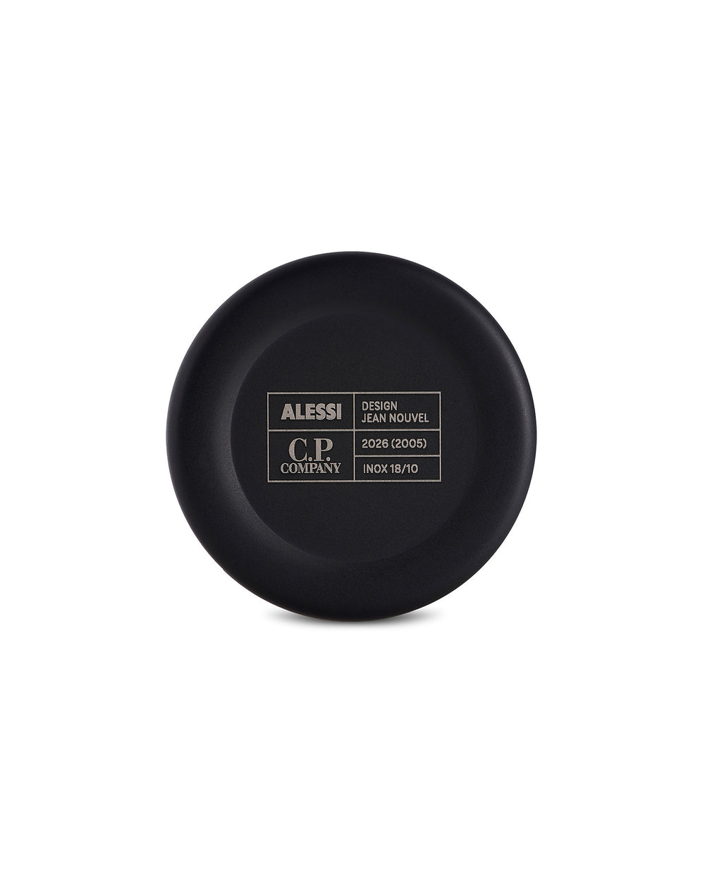 Black circular cup bottom by Alessi, engraved with brand, designer, and material details in a contrasting white grid.