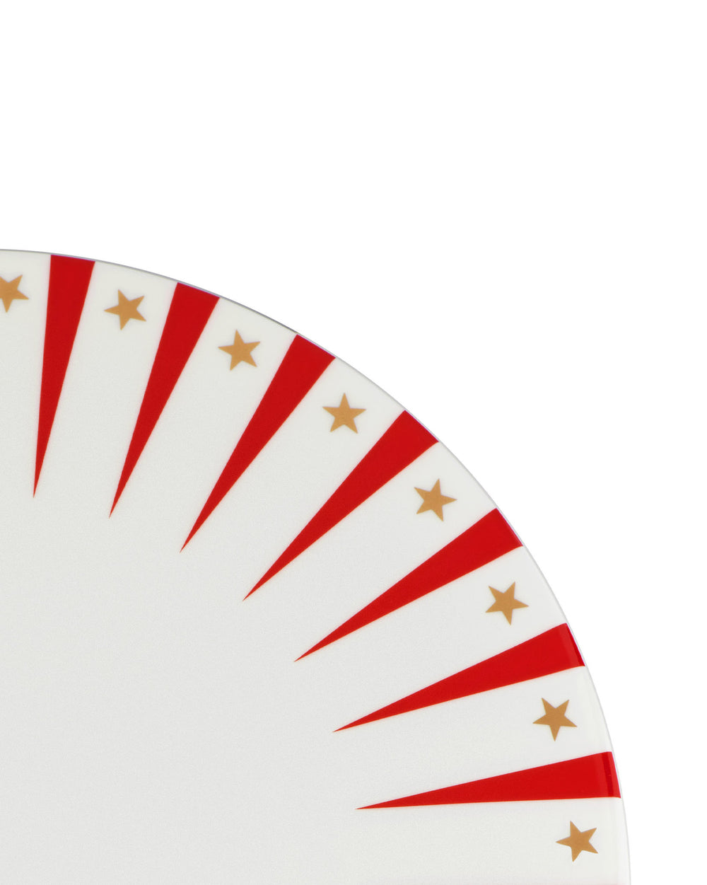 White Christmas plate by Alessi with radial red stripes and gold stars, cropped view.