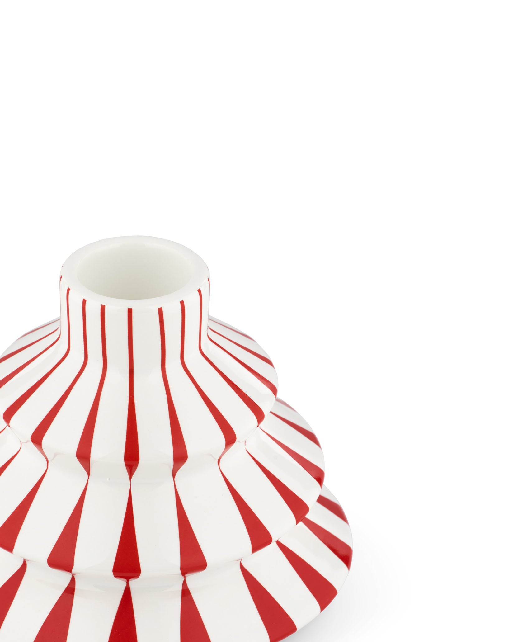 White and red striped tiered candlestick by Alessi, cropped from a top-down angle.