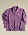 Lilac lightweight crinkled jacket by Alessi, with button front, chest and sleeve pockets, and C.P. Company lens badge.
