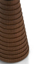 Dark brown wooden spice grinder by Alessi, with a ridged, stacked design, in a cropped close-up.