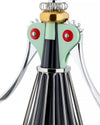 Mint green and black Anna G. corkscrew by Alessi with silver levers, a gold head, and a ribbed base.