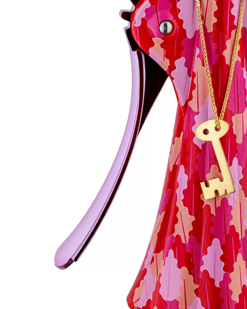 Red and pink patterned corkscrew by Alessi with a purple lever arm and a gold key pendant.