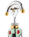 Chrome and gold corkscrew by Alessi, designed as a smiling woman with a light green body and red accents.