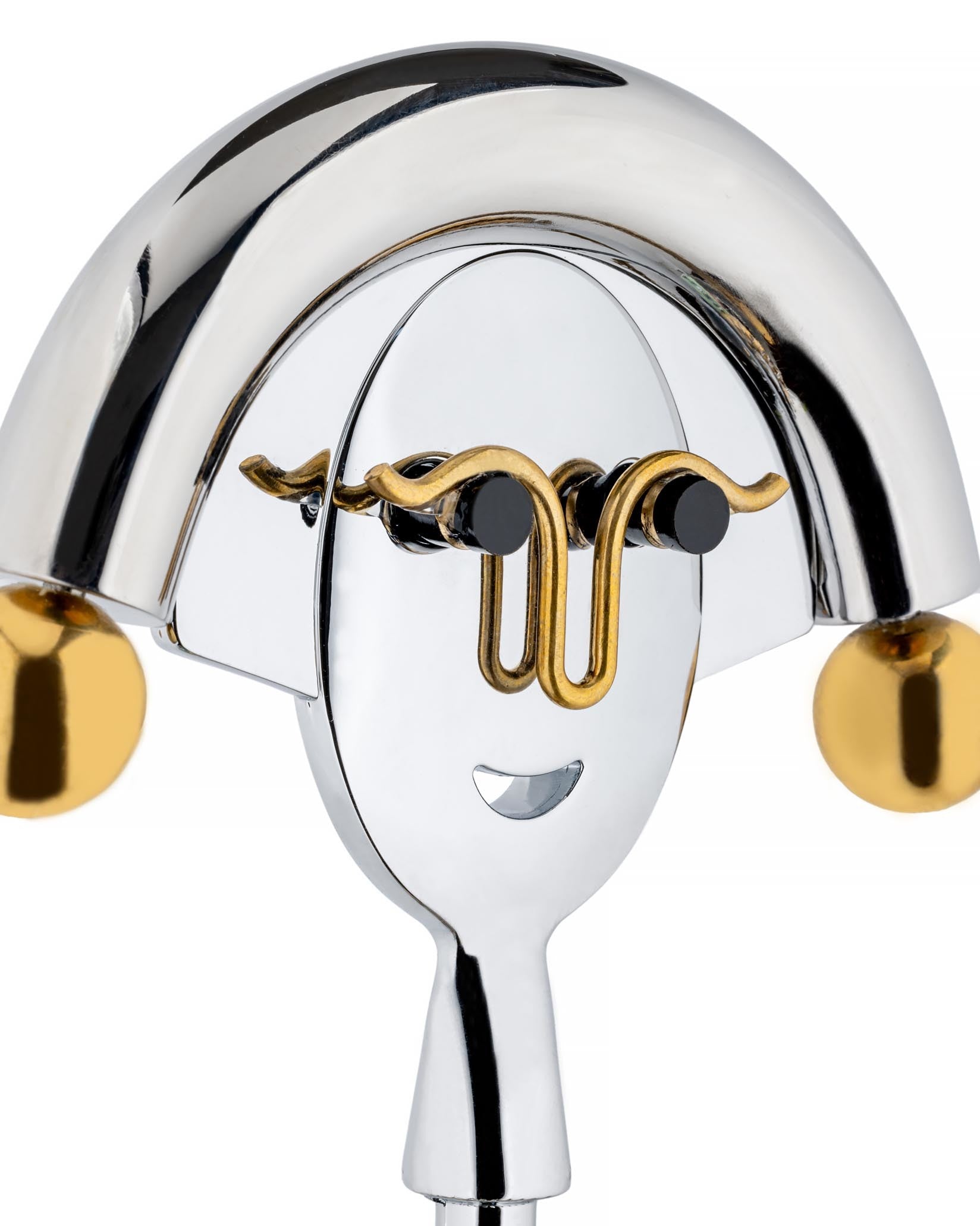 Chrome and gold corkscrew by Alessi, designed with a smiling face and curly gold accents.