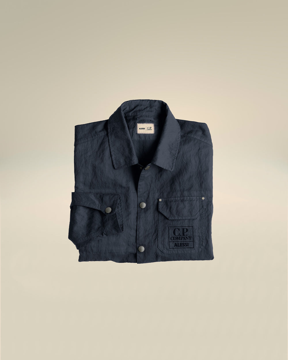 Dark blue linen jacket by Alessi, with visible Alessi and C.P. Company logos on the collar and chest pocket.