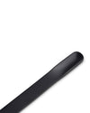 Black cup by Alessi with a sleek, elongated form and a smooth, matte finish.