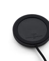 Black round Halesia lamp by Alessi, with a textured surface, a braided cord, and embossed designer names.