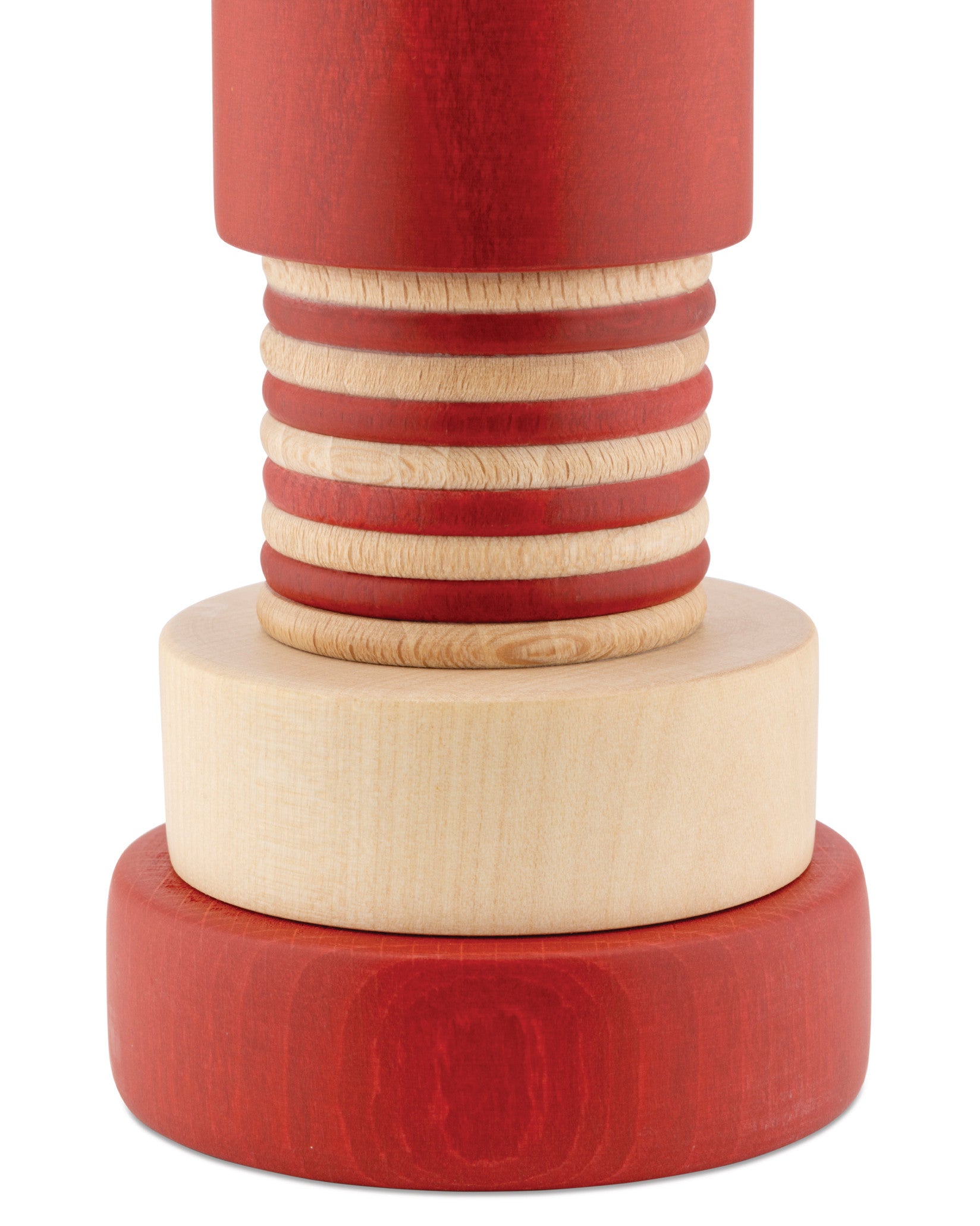 Red and natural wood spice grinder by Alessi with a ribbed, layered design, featuring a wide red base.