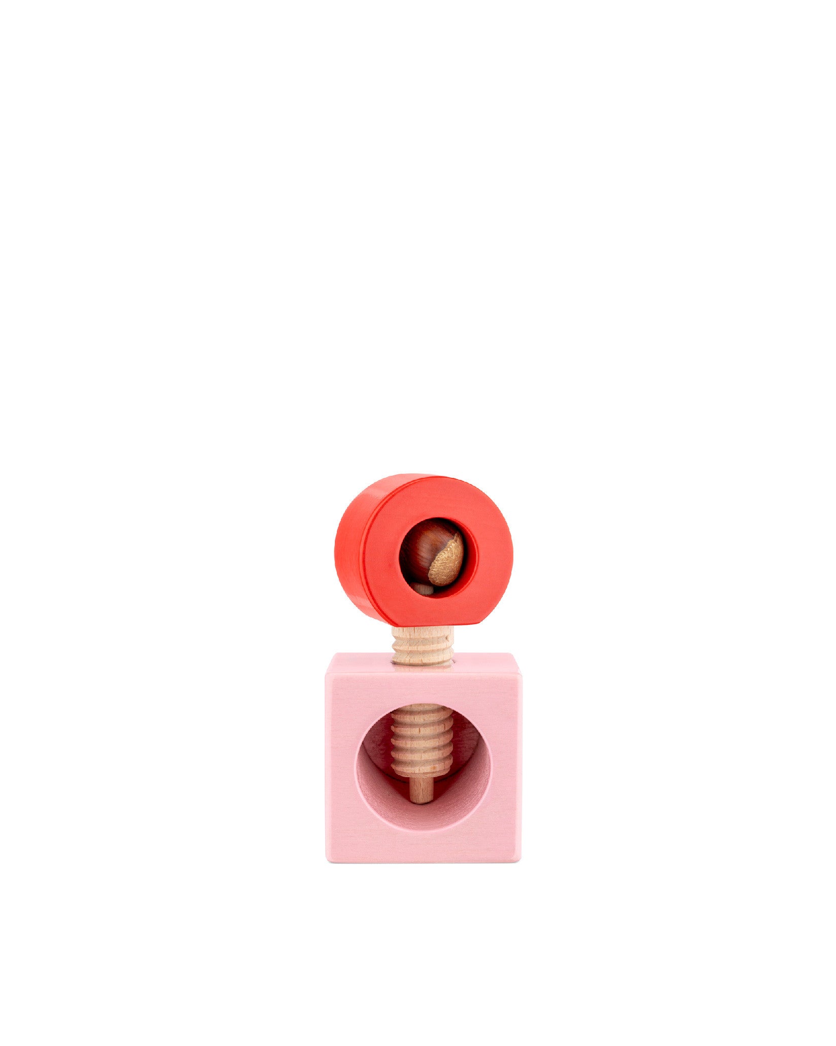 Wooden nutcracker with red and pink elements by Alessi, holding a hazelnut, showcasing a screw mechanism.