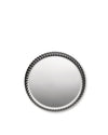 Round metallic tray by Alessi with a dark gray pleated rim, casting a soft shadow.