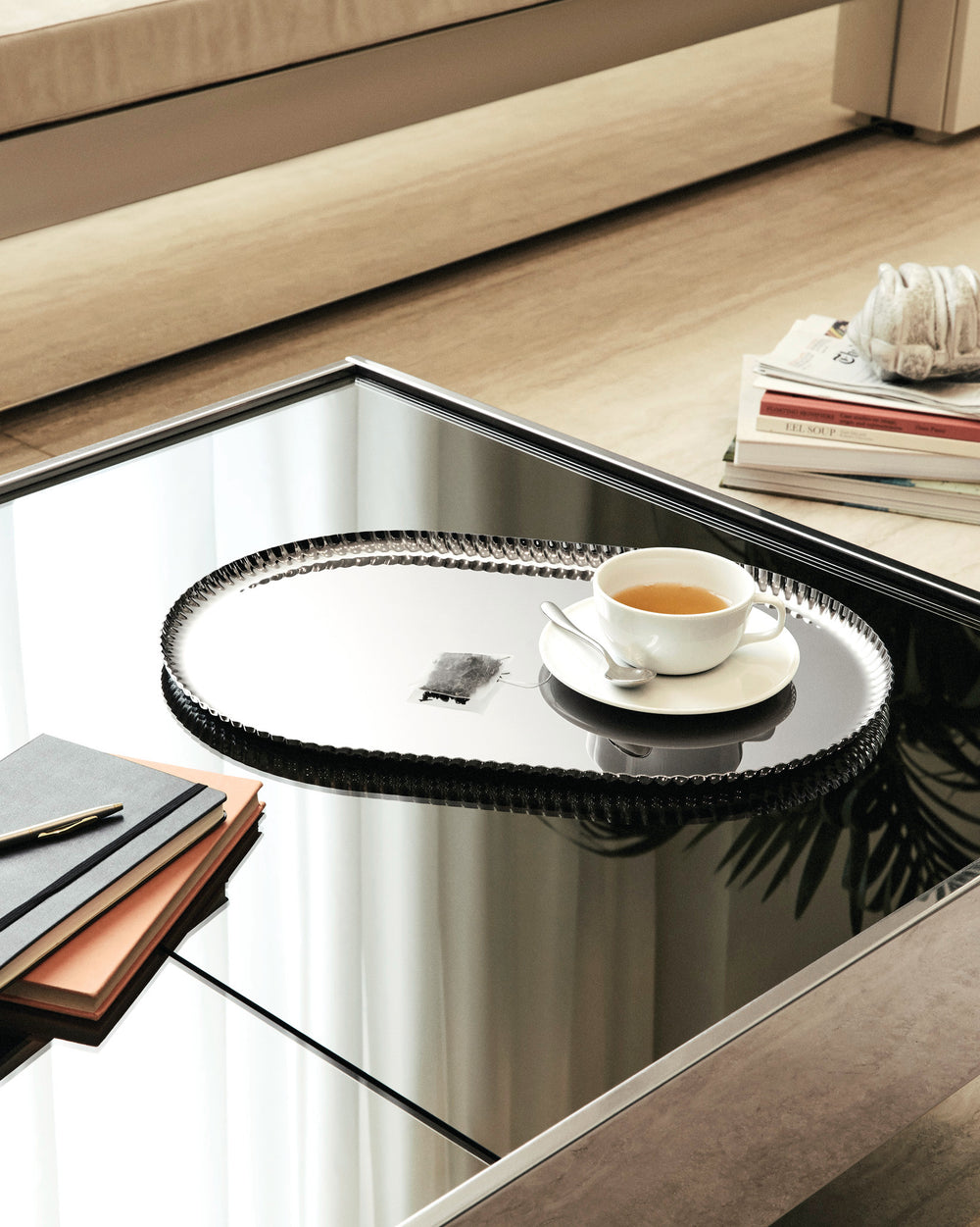 Silver oval Pleats tray by Alessi, featuring a decorative scalloped edge.