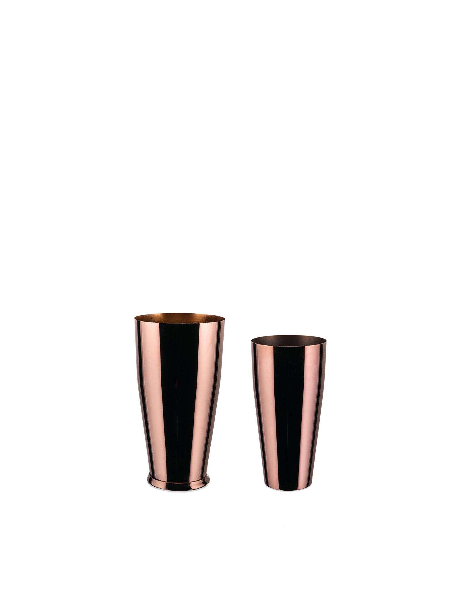 Two copper cocktail shakers by Alessi, of different sizes, with reflective surfaces, on a white background.