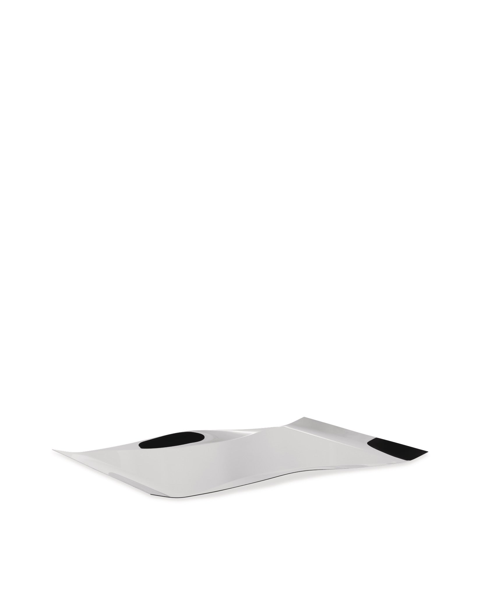 Silver wavy Mao-Mao tray by Alessi with two black indentations, viewed from a low angle.